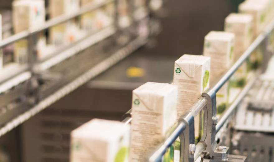 Packaged products on an automated production line in a manufacturing environment.