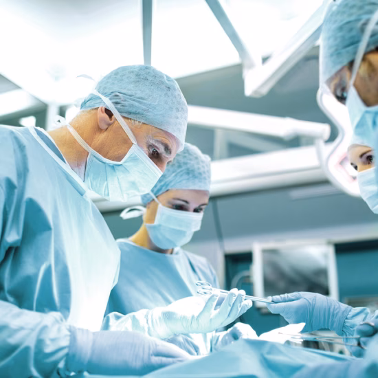 A surgical team performs a medical procedure in an operating room